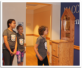 Maddie and Bailey wait for Lily to ring the cancer free bell!